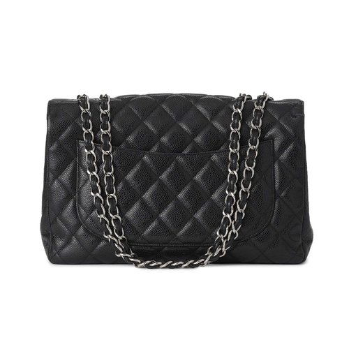 374 - Chanel, a Jumbo Classic Flap handbag, featuring a black caviar quilted leather exterior, with polish... 