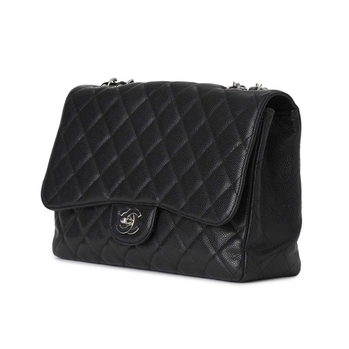 374 - Chanel, a Jumbo Classic Flap handbag, featuring a black caviar quilted leather exterior, with polish... 