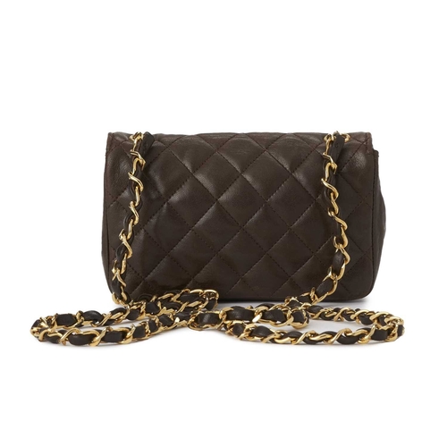 375 - Chanel, a vintage Mini Classic Flap handbag, crafted from brown quilted lambskin leather, with 24ct ... 