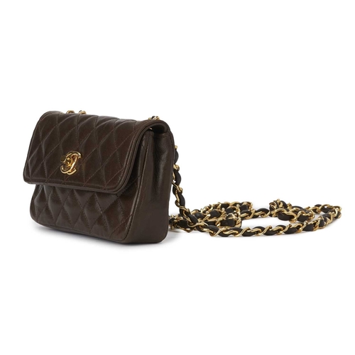 375 - Chanel, a vintage Mini Classic Flap handbag, crafted from brown quilted lambskin leather, with 24ct ... 