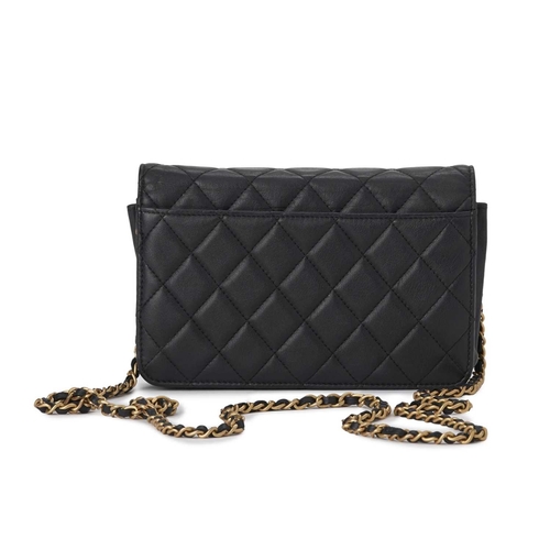 377 - Chanel, an Enchained Wallet On Chain handbag, crafted from black calfskin quilted leather, featuring... 