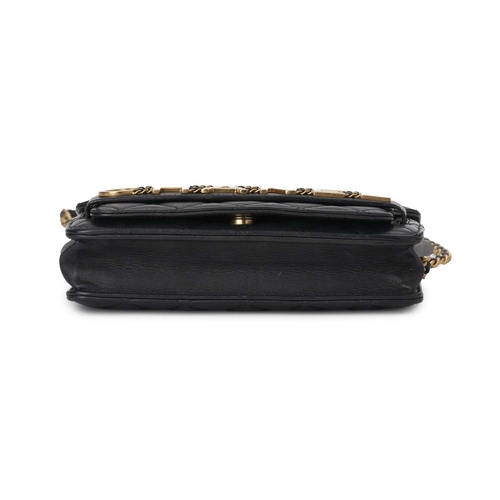 377 - Chanel, an Enchained Wallet On Chain handbag, crafted from black calfskin quilted leather, featuring... 