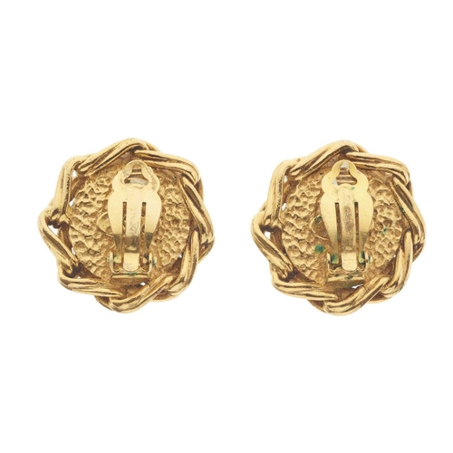 382 - Chanel, a pair of clip-on earrings, featuring an imitation pearl at the centre and a gold-tone linke... 