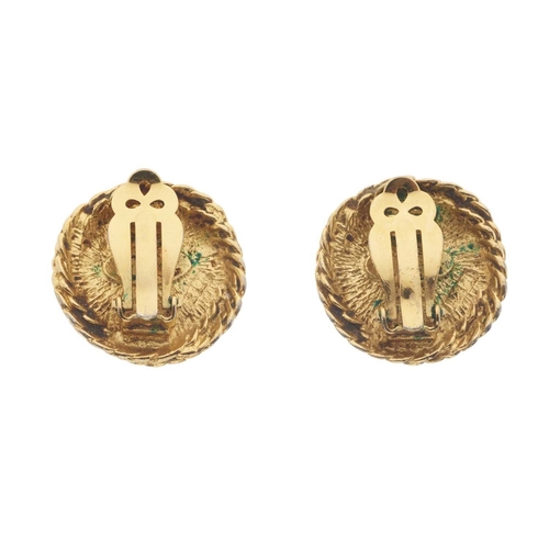 383 - Chanel, a pair of clip-on earrings, featuring an imitation pearl to the centre and textured gold-ton... 