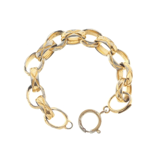 389 - Chanel, a vintage keyring and bracelet, to include a quilted gold-tone oval-link bracelet with sprin... 