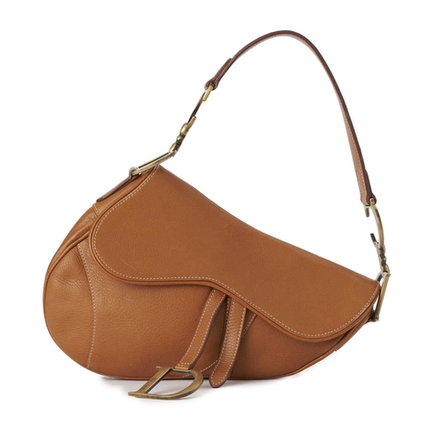 394 - Christian Dior, a leather Saddle handbag, crafted from caramel leather, featuring a flat shoulder st... 