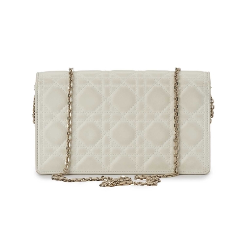 396 - Christian Dior, a white Cannage chain clutch, designed with the maker's signature cannage quilted wh... 