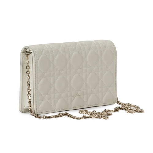 396 - Christian Dior, a white Cannage chain clutch, designed with the maker's signature cannage quilted wh... 