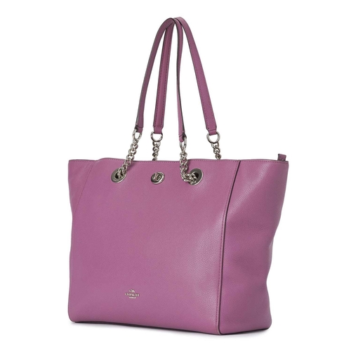 400 - Coach, a Turnlock Chain tote, designed with a mauve pink pebbled leather exterior, polished silver-t... 