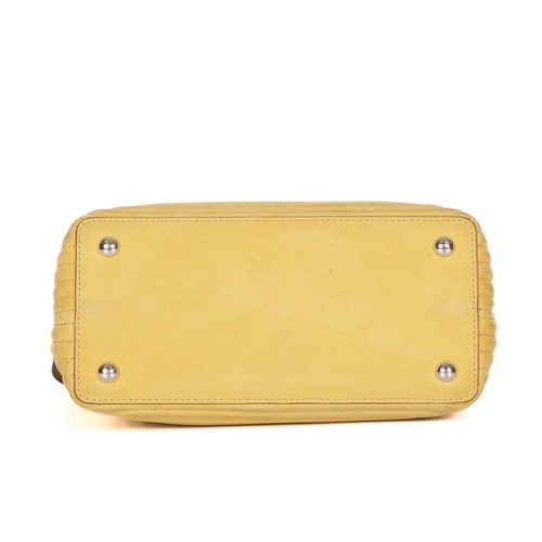 408 - Fendi, a yellow Dotcom handbag, designed with a quilted yellow nubuck leather exterior, silver-tone ... 