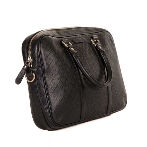 414 - Gucci, a black leather Diamante briefcase, featuring the maker's black leather diamante patterned ex... 