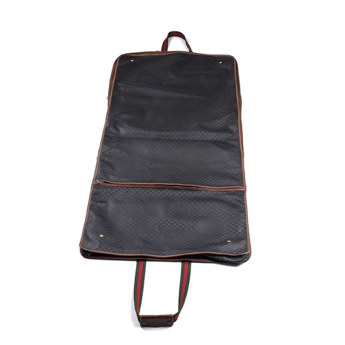 417 - Gucci, a vintage garment cover, crafted from micro GG monogram coated canvas with brown leather trim... 