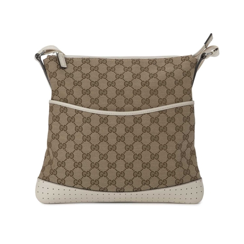 418 - Gucci, a medium messenger bag, designed with the maker's GG monogram canvas exterior with cream leat... 