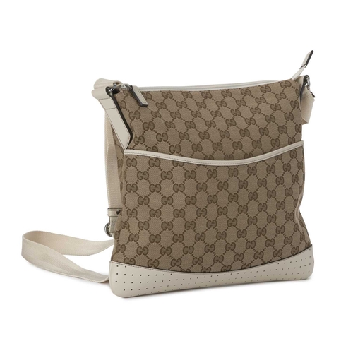 418 - Gucci, a medium messenger bag, designed with the maker's GG monogram canvas exterior with cream leat... 