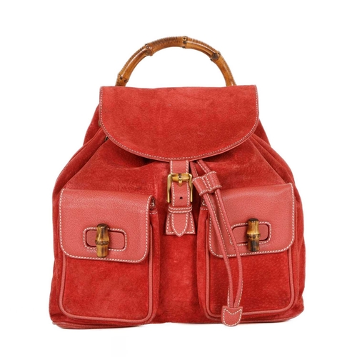 419 - Gucci, a large Bamboo backpack, featuring a red suede exterior with grained red leather trim, curved... 