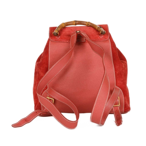 419 - Gucci, a large Bamboo backpack, featuring a red suede exterior with grained red leather trim, curved... 