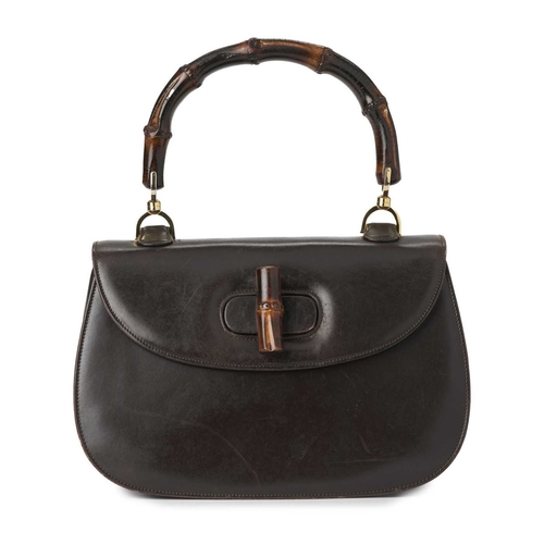 420 - Gucci, a vintage Bamboo Top Handle handbag, crafted from smooth brown leather, featuring a curved ba... 