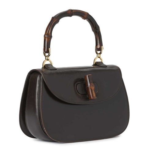 420 - Gucci, a vintage Bamboo Top Handle handbag, crafted from smooth brown leather, featuring a curved ba... 