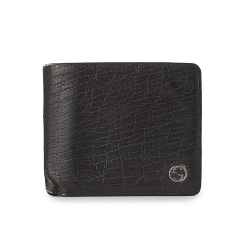 426 - Gucci, a leather bifold wallet, crafted from grained black leather, with a small gunmetal GG plaque ... 