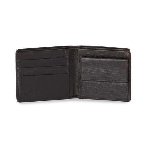 426 - Gucci, a leather bifold wallet, crafted from grained black leather, with a small gunmetal GG plaque ... 