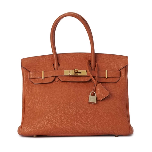 430 - Hermes, a 2004 Birkin 30 handbag, designed with a grained orange leather exterior with gold-plated h... 