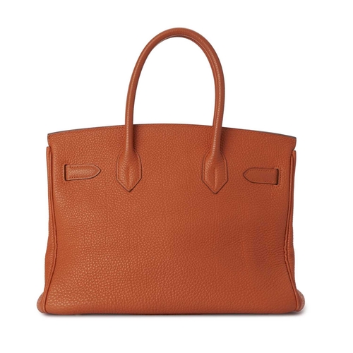 430 - Hermes, a 2004 Birkin 30 handbag, designed with a grained orange leather exterior with gold-plated h... 