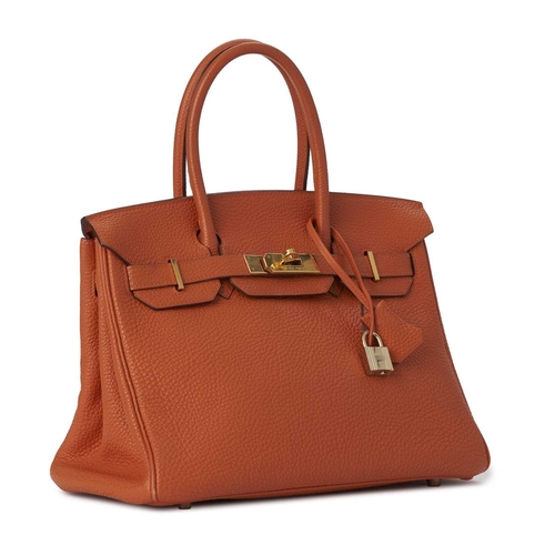 430 - Hermes, a 2004 Birkin 30 handbag, designed with a grained orange leather exterior with gold-plated h... 