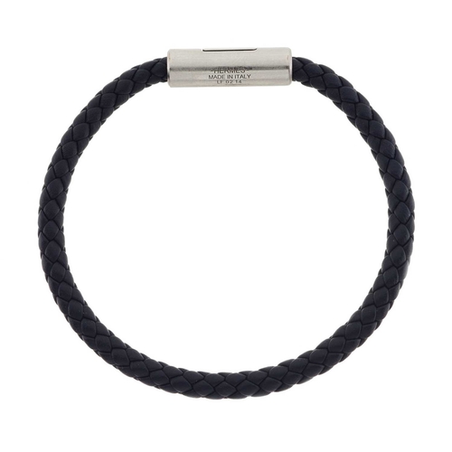 435 - Hermes, a Puzzle H braided bracelet, featuring a black leather braided cord, with the maker's pallad... 