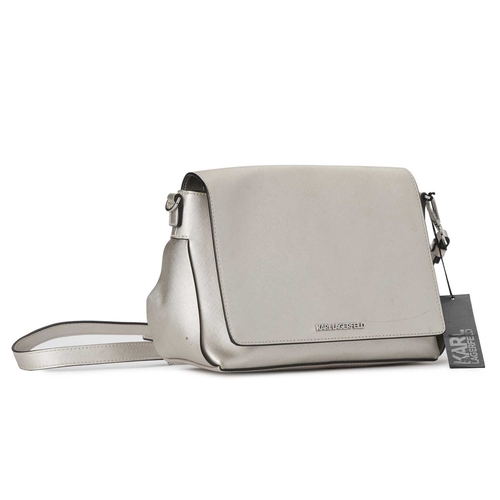 438 - Karl Lagerfeld, a metallic flap handbag, featuring a metallic silver faux leather exterior, with a d... 