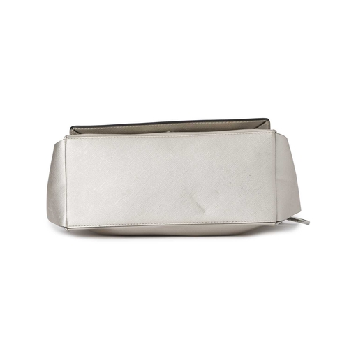 438 - Karl Lagerfeld, a metallic flap handbag, featuring a metallic silver faux leather exterior, with a d... 