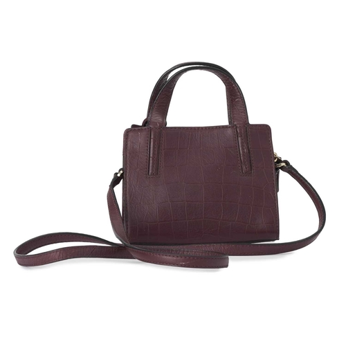 439 - Kate Spade, a small embossed handbag, designed with a burgundy crocodile embossed leather exterior, ... 