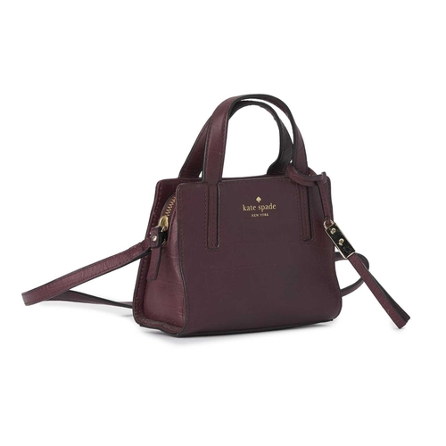 439 - Kate Spade, a small embossed handbag, designed with a burgundy crocodile embossed leather exterior, ... 