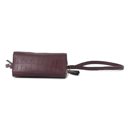 439 - Kate Spade, a small embossed handbag, designed with a burgundy crocodile embossed leather exterior, ... 