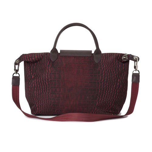 443 - Longchamp, a Le Pliage crossbody handbag, designed with a crocodile printed purple nylon exterior, w... 