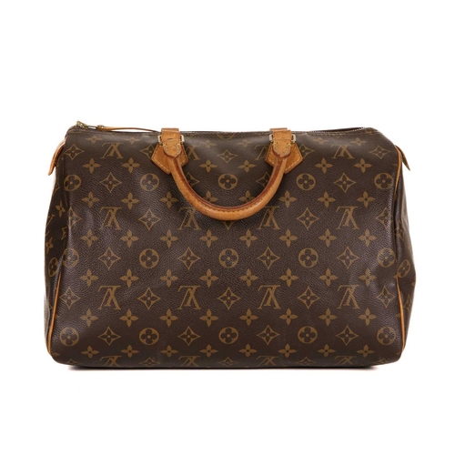 464 - Louis Vuitton, a monogram Speedy 35 handbag, featuring the maker's monogram coated canvas exterior w... 