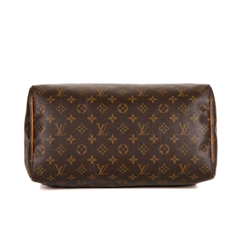 464 - Louis Vuitton, a monogram Speedy 35 handbag, featuring the maker's monogram coated canvas exterior w... 