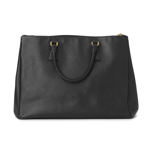 506 - Prada, a Galleria handbag, crafted from black saffiano leather, with gold-tone hardware accents, mak... 