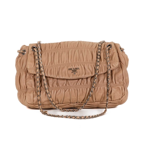 509 - Prada, a Gaufre leather handbag, featuring a gathered beige leather exterior with polished silver-to... 