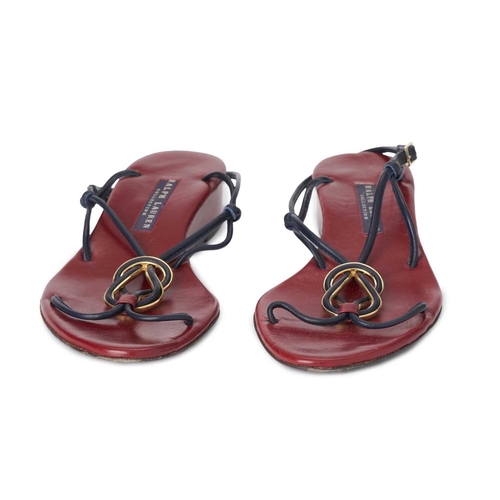 513 - Ralph Lauren, a pair of purple label T-strap sandals, featuring navy blue leather straps, decorative... 