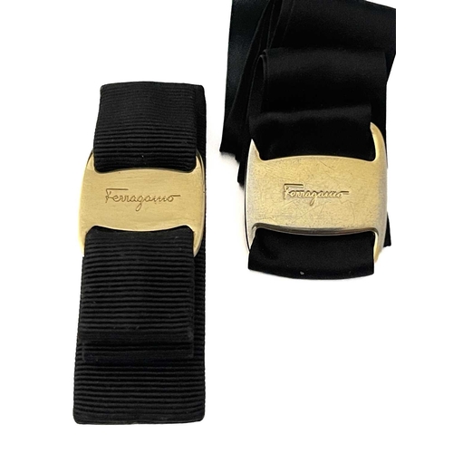 514 - Salvatore Ferragamo, a Vara bow clip and a buckle, to include a black grosgrain Vara bow hair clip w... 