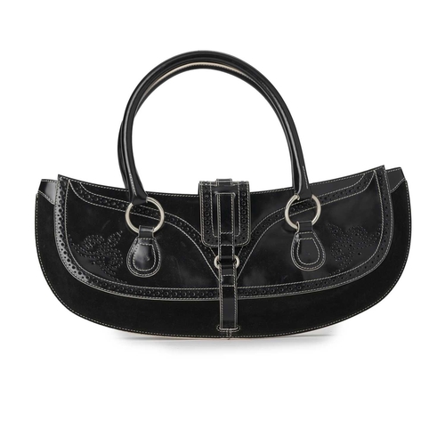 519 - Tanner Krolle, a large baguette handbag, featuring a smooth black leather exterior with perforated d... 