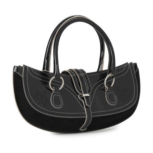 519 - Tanner Krolle, a large baguette handbag, featuring a smooth black leather exterior with perforated d... 