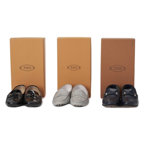 528 - Tod's, three pairs of ladies loafers, to include a black patent leather pair, featuring a double T f... 