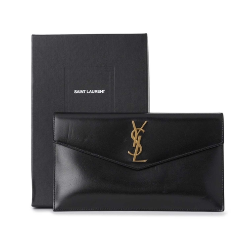 534 - Yves Saint Laurent, an envelope clutch, crafted from smooth black leather, featuring the maker's gol... 