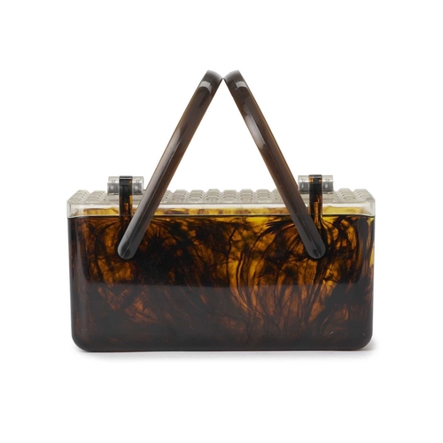 535 - A 1950s Merle Norman Lucite box handbag, featuring a faux tortoise shell exterior, with a clear hobn... 