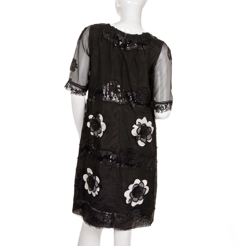 538 - Three vintage dresses, to include a black knee-length dress with sequin embellishment and white and ... 