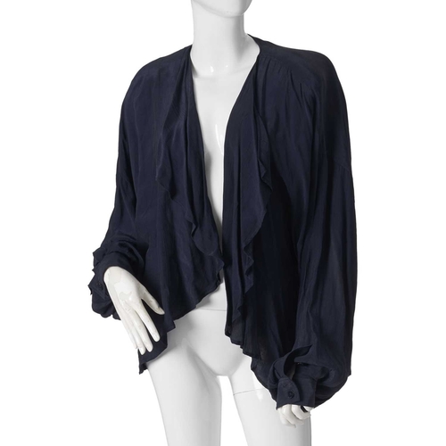 544 - Jean Muir, four items of ladies clothing and a Nina Ricci coat, to include a long navy blue cotton t... 