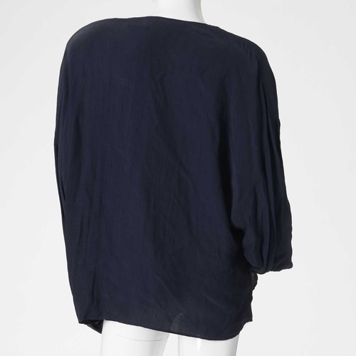 544 - Jean Muir, four items of ladies clothing and a Nina Ricci coat, to include a long navy blue cotton t... 