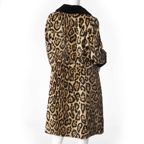 547 - Bergdorf Goodman, a faux fur coat with real seal fur trim, featuring a stencilled leopard patterned ... 