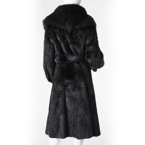 550 - Regency Furs, a black musquash fur coat with fox fur collar, featuring hook and eye clip fastenings ... 